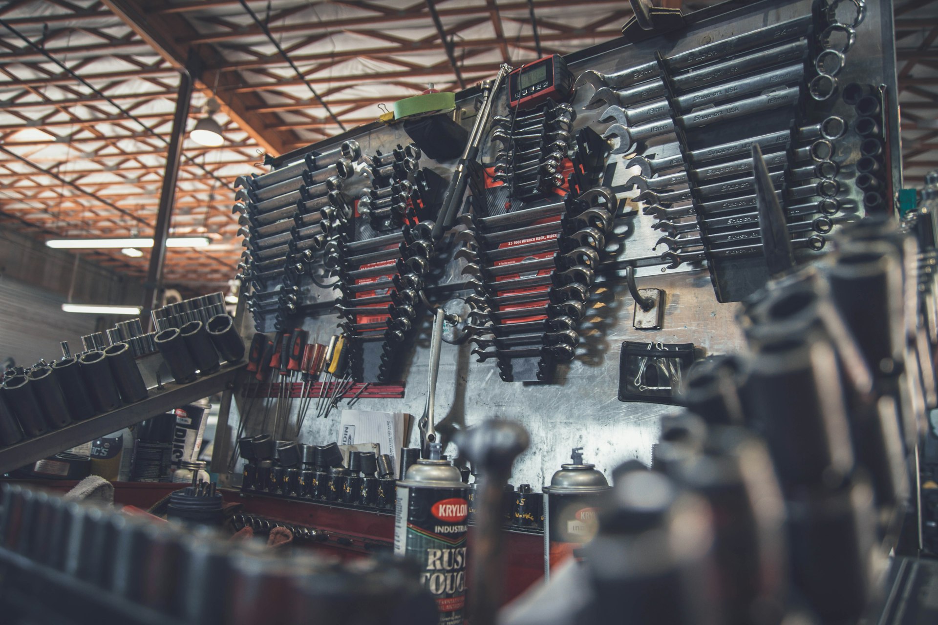 Technician working under a lifted car